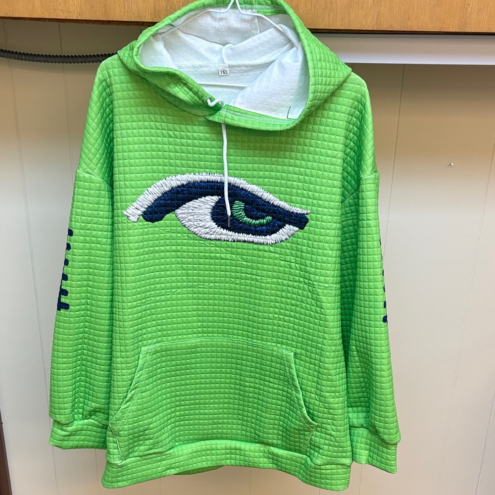 Green Quilted Hoodie with Eye Design